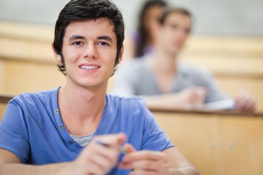 Student listening to a lecturer clipart