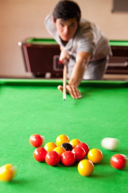 Portrait of a man starting a pool game clipart