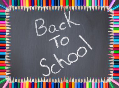 Back to school written on a blackboard framed with colored pencil clipart