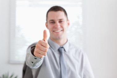 Smiling businessman approves clipart