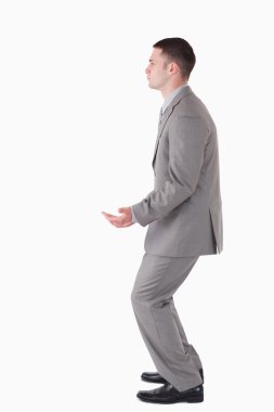 Portrait of a businessman carrying something clipart