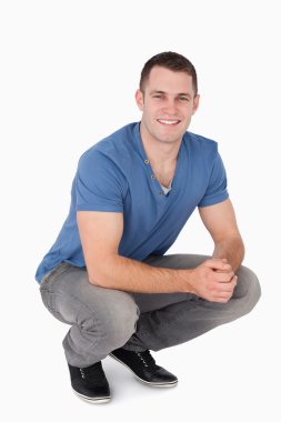 Portrait of a man squatting clipart