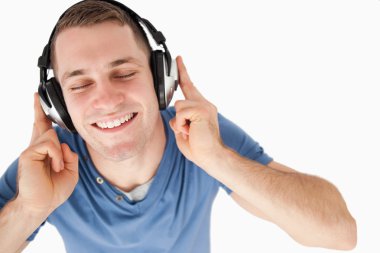 Happy man listening to music clipart