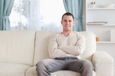 Man sitting on a couch clipart
