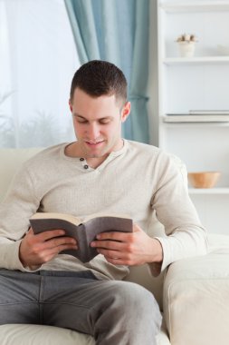 Portrait of a man reading a book clipart