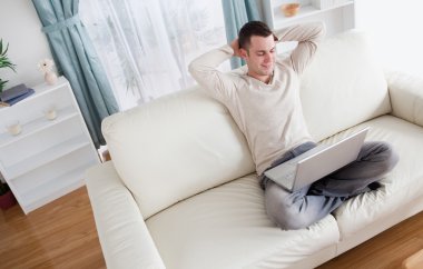 Serene man using a notebook clipart