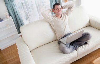 Man enjoying using a notebook clipart