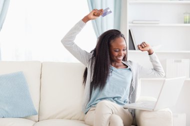 Woman happy about what she bought online clipart