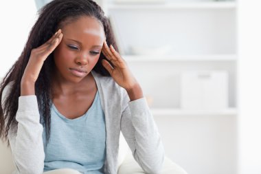 Woman experiencing a headache clipart