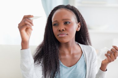 Close up of woman measuring her temperature clipart