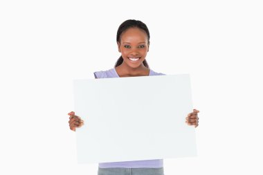 Woman holding placeholder in her hands on white background clipart