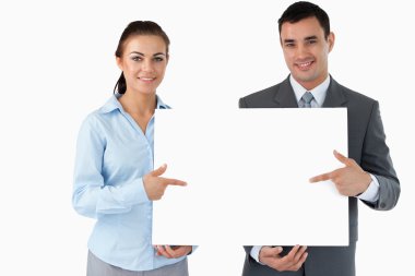 Business partners presenting sign together clipart