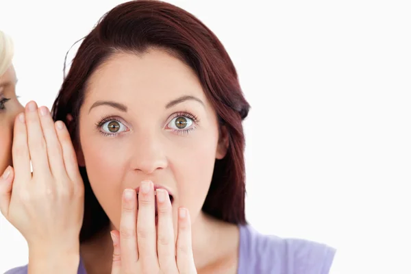 Close up of a shocked women being told a secret — Stock Photo, Image