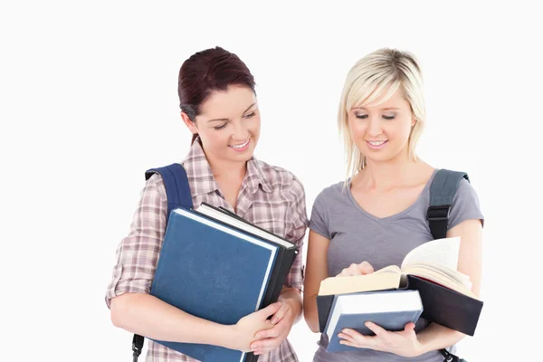 Female students reading a book — Stock Photo, Image