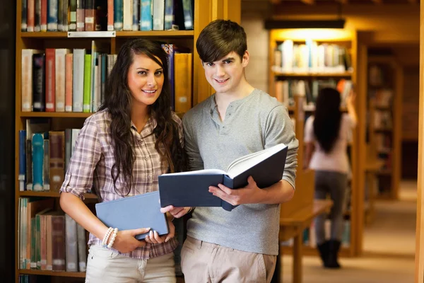 Smart students with a book — Stock Photo, Image