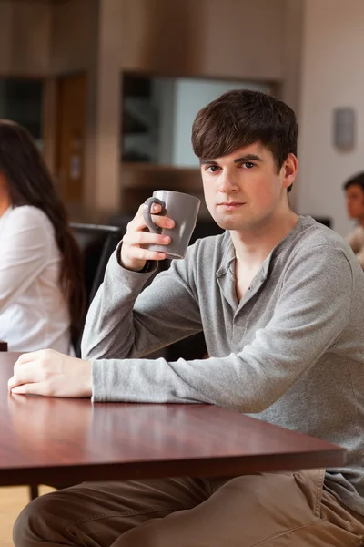 Portrait of a young man having a coffee — Stock Photo, Image