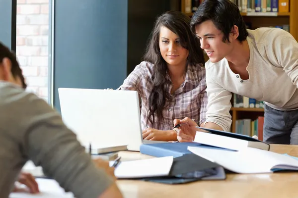 Smiling students working together — Stock Photo, Image