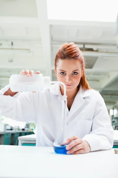 Portrait of a cute science student doing an experiment — Stock Photo, Image