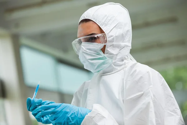 Protected science student posing with dangerous liquid — Stock Photo, Image