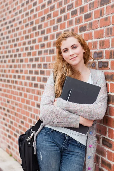 Portrait of a lovely student holding her binder — Stock Photo, Image
