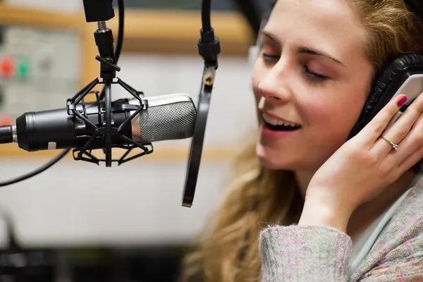 Close up of a singer recording a track — Stock Photo, Image