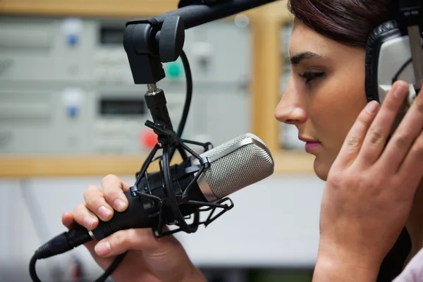 Close up of a cute singer recording a track — Stock Photo, Image