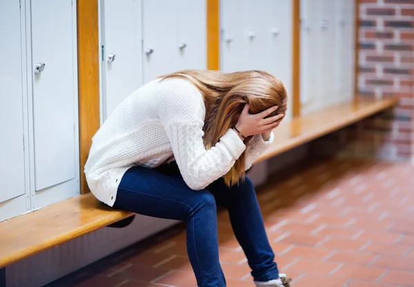 Depressed student sitting on a bench — Stock Photo, Image