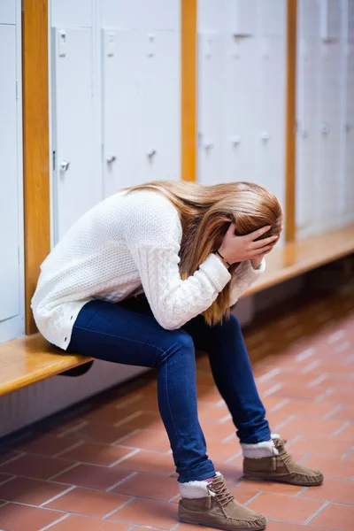 Portrait of a depressed student sitting on a bench — Stock Photo, Image