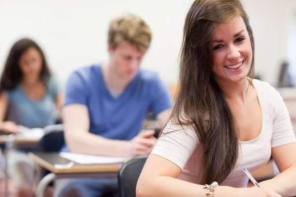 Attractive students having a test — Stock Photo, Image