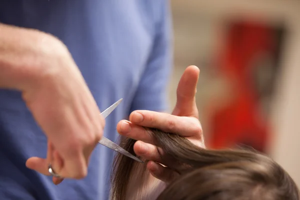 Close up of a masculine hand cutting hair — Stock Photo, Image