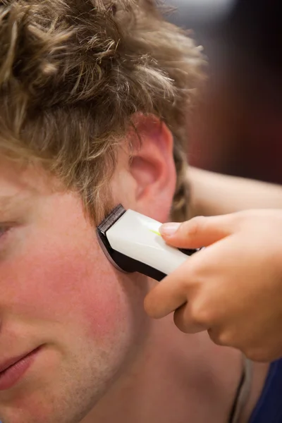 stock image Portrait of a young man having a haircut