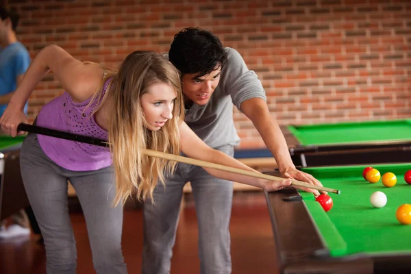 Young couple playing snooker — Stock Photo, Image