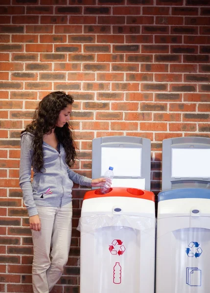 Portrait of a young woman recycling — Stock Photo, Image