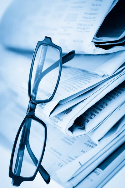 stock image Newspapers and black glasses