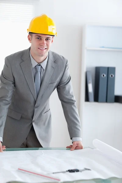 Standing architect with helmet on — Stock Photo, Image