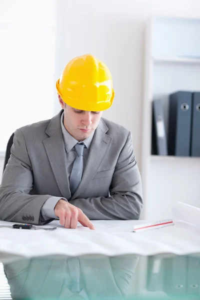 Close up of architect checking a plan — Stock Photo, Image