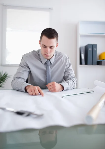 Close up of architect working on construction plan — Stock Photo, Image