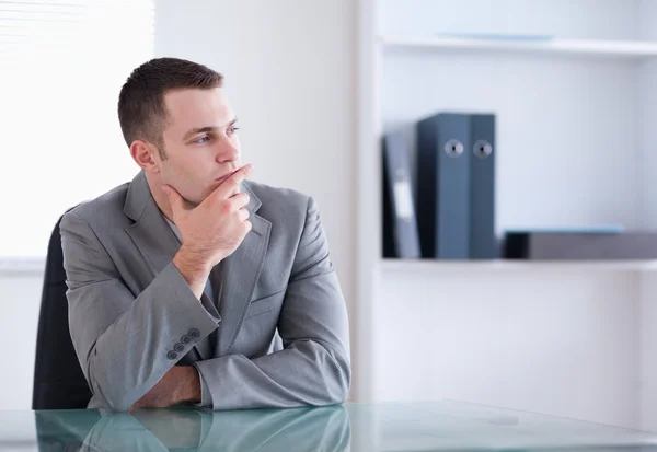 Businessman thinking and sitting — Stock Photo, Image