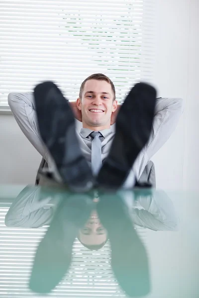 Close up of young businessman sitting back — Stock Photo, Image