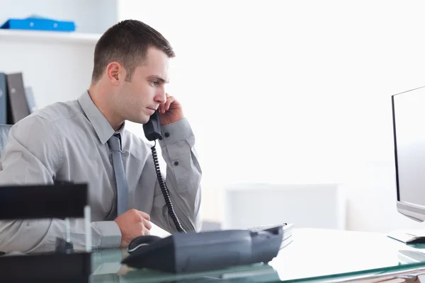 Businessman answering the phone — Stock Photo, Image