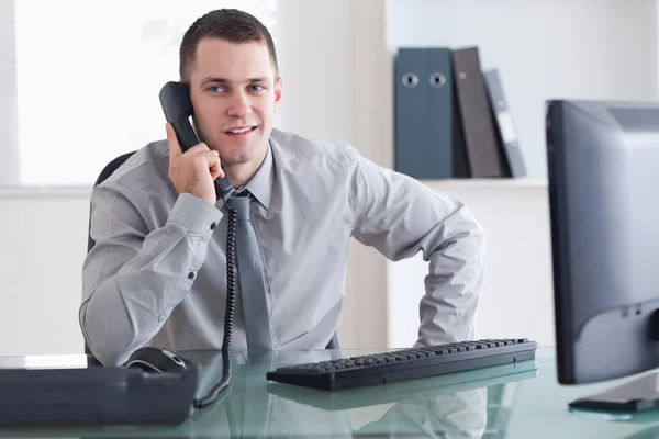 Businessman listening carefully to caller — Stock Photo, Image