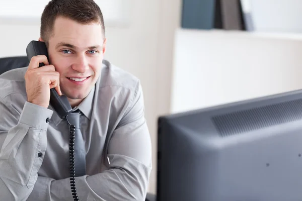 Businessman getting good news on the phone — Stock Photo, Image