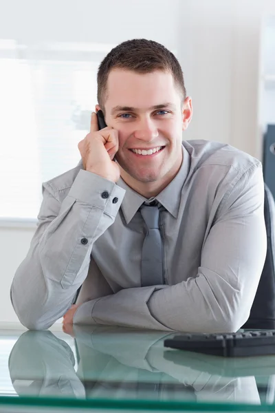 Businessman getting a pleasant call — Stock Photo, Image