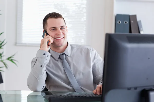 Happy businessman getting pleasant call — Stock Photo, Image