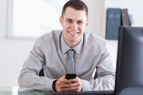 Businessman happy about a text message — Stock Photo, Image