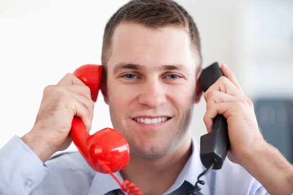 Close up handling the telephone stress smiling — Stock Photo, Image