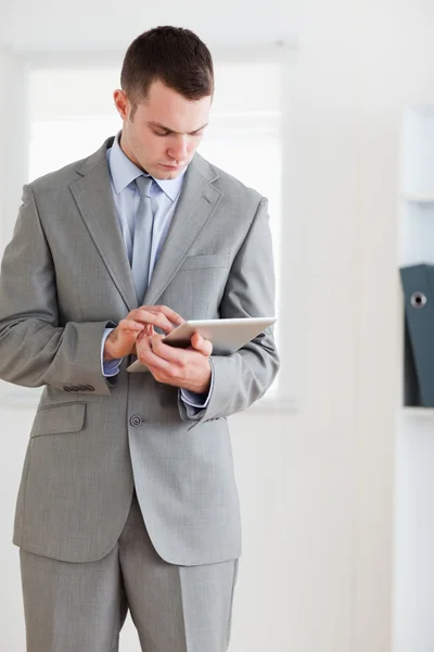 Businessman having a look at his notes — Stock Photo, Image