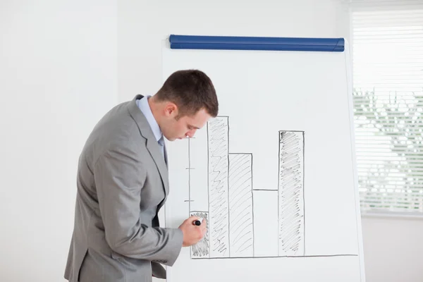 Businessman editing column graph — Stock Photo, Image