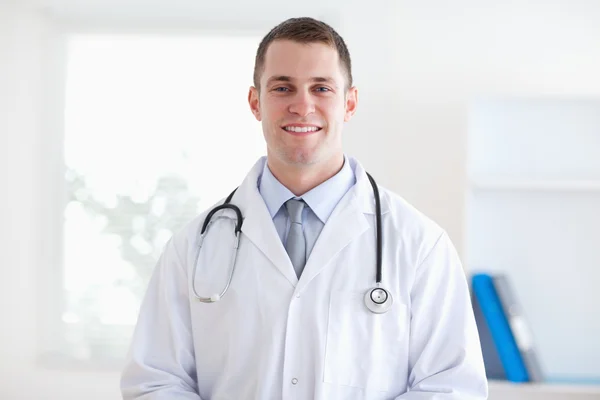 Smiling doctor in his practice — Stock Photo, Image