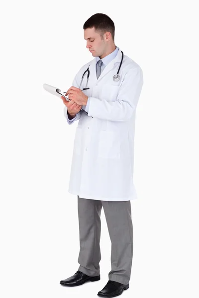 Doctor writing down notes — Stock Photo, Image